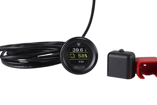 Fleet Lithium Textron / Tracker Prowler EV (2017-2021) (72V) Fleet Lithium Conversion Kit digital state-of-charge gauge displaying 39.6V and 58% charge, with battery terminal covers next to it.