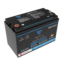 Fleet Lithium BlueMax Marine 12V 200Ah LiFePO4 Deep Cycle Battery (Group 27) top-down view showing positive and negative terminals, product labels with "MSDS / UN38.3", "Maintenance Free", "Eco-Friendly", "Bluetooth", "Dual Purpose", "Starting Battery", "Deep Cycle", "1200 Cranking Amps", "12V 105AH", and safety notices.