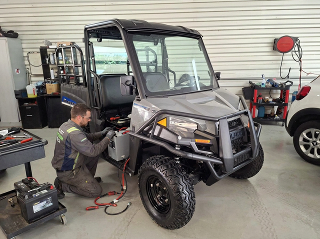 Fleet Lithium 51 Volt Battery Bundle for Polaris Ranger EV (2010–2024) being installed in a gray utility vehicle.