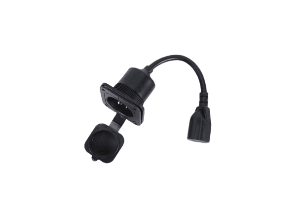 Fleet Lithium Body Mounted AC Power Plug, side view showing the AC receptacle with its protective cap closed, and the female end of the power cord.