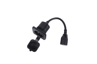 Fleet Lithium Body Mounted AC Power Plug, side view showing the AC receptacle with its protective cap closed, and the female end of the power cord.