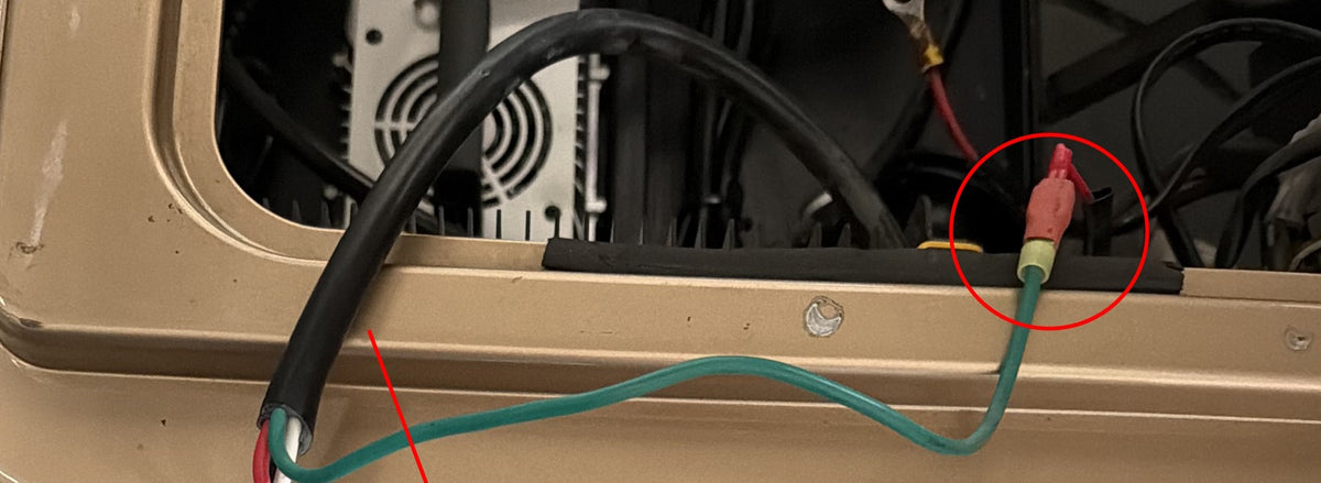 Separate close-up from the Tomberlin installation showing the identified legacy charger lead; verify the exact circuit before connecting.